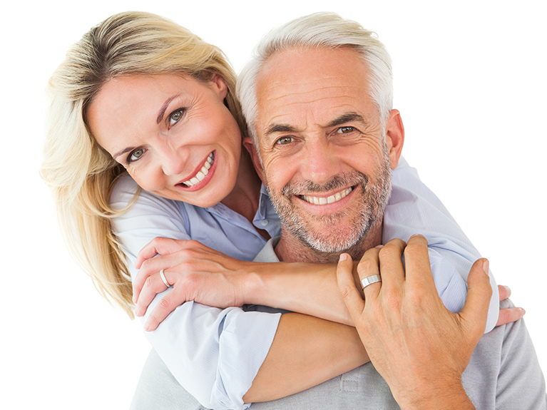 Happy middle-aged couple smiling and hugging